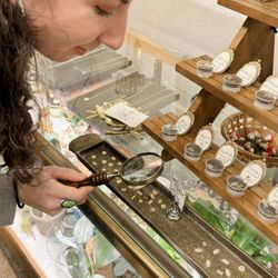 Honey Lily Boutique - Looking at the charms for the permanent bracelet