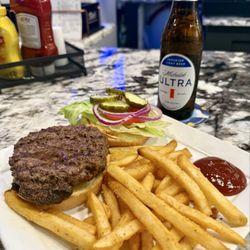 The District Sports & Social - Tasty, juicy, big freaking burger. So good! Fries are seasoned perfectly.