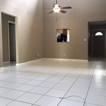 The Remodeling Team - an empty living room - Painters Near Me The Remodeling Team - an empty living room - Painters Near Me