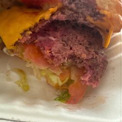 Ordered a burger and it came uncooked with raw meat .