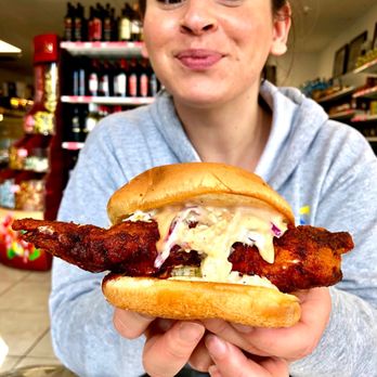 Crazy D's Hot Chicken - A happy customer with her Medium spice chicken sandwich. - Chicken Shop Near Me - Reno, Nevada Crazy D's Hot Chicken - A happy customer with her Medium spice chicken sandwich. - Chicken Shop Near Me - Reno, Nevada