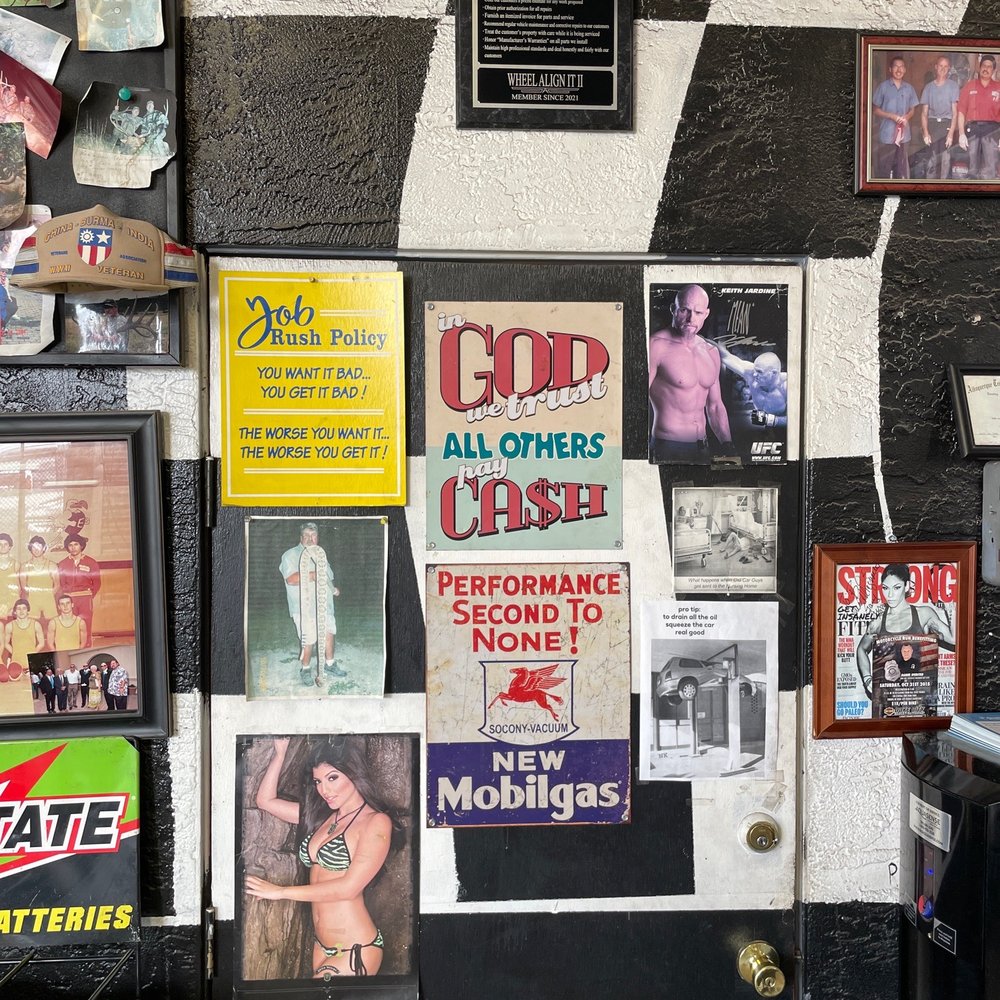 All the evidence of a legit mechanic: Swimsuit models, UFC fighters, and an auto repair certification.