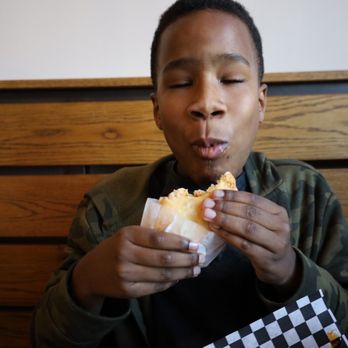 Empamamas - My son enjoying the Buffalo Soldier. - Empanadas Near Me - Tampa, Florida