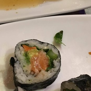 Sushi Tango - Spicy Salmon Roll WITHOUT the actual Spice.  As you can see in this close up photo, there is no spicy sauce coated on the salmon meat itself - Sushi Bars Near Me - Woodbury, Minnesota
