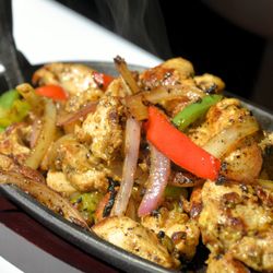 TEXAMEX Restaurant - FAJITAS:
sizzle skillet, grilled peppers & onions, w/ guacamole, pico, crema, jack cheese, garlic butter, & tortillas