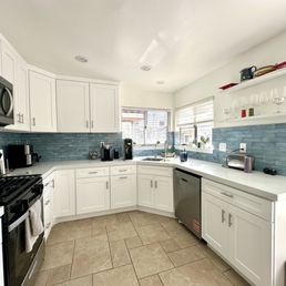 Kitchen with cabinets, backsplash and countertops