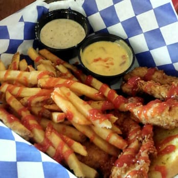 Mia's Table - Chicken basket w fries and a garlic bread with , a cup of cheese and jalapeño cream gravy :D - American Near Me - Houston, Texas