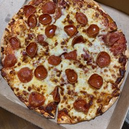 Pepperoni pizza on thin crust Pepperoni pizza on thin crust