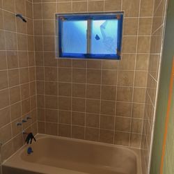 European Reglazing - Before & After of bathroom tub and tile.