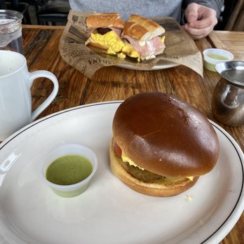 Casa Cubana - Crisp Avo and Egg breakfast sandwich (front) Calle Ocho Breakfast Sandwich (back) - Cuban Near Me - Raleigh, North Carolina Casa Cubana - Crisp Avo and Egg breakfast sandwich (front) Calle Ocho Breakfast Sandwich (back) - Cuban Near Me - Raleigh, North Carolina