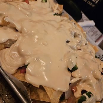 Tiki Jac’s Street Eats & Brews - Huge plate of nachos and no they didn't get soggy - Beer, Wine & Spirits Near Me - Rehoboth Beach, Delaware Tiki Jac’s Street Eats & Brews - Huge plate of nachos and no they didn't get soggy - Beer, Wine & Spirits Near Me - Rehoboth Beach, Delaware