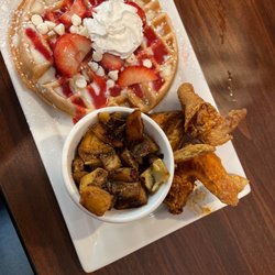 Wayne’s Waffle House - Strawberry white chocolate (wayne signature waffle) with potatoes and chicken wings