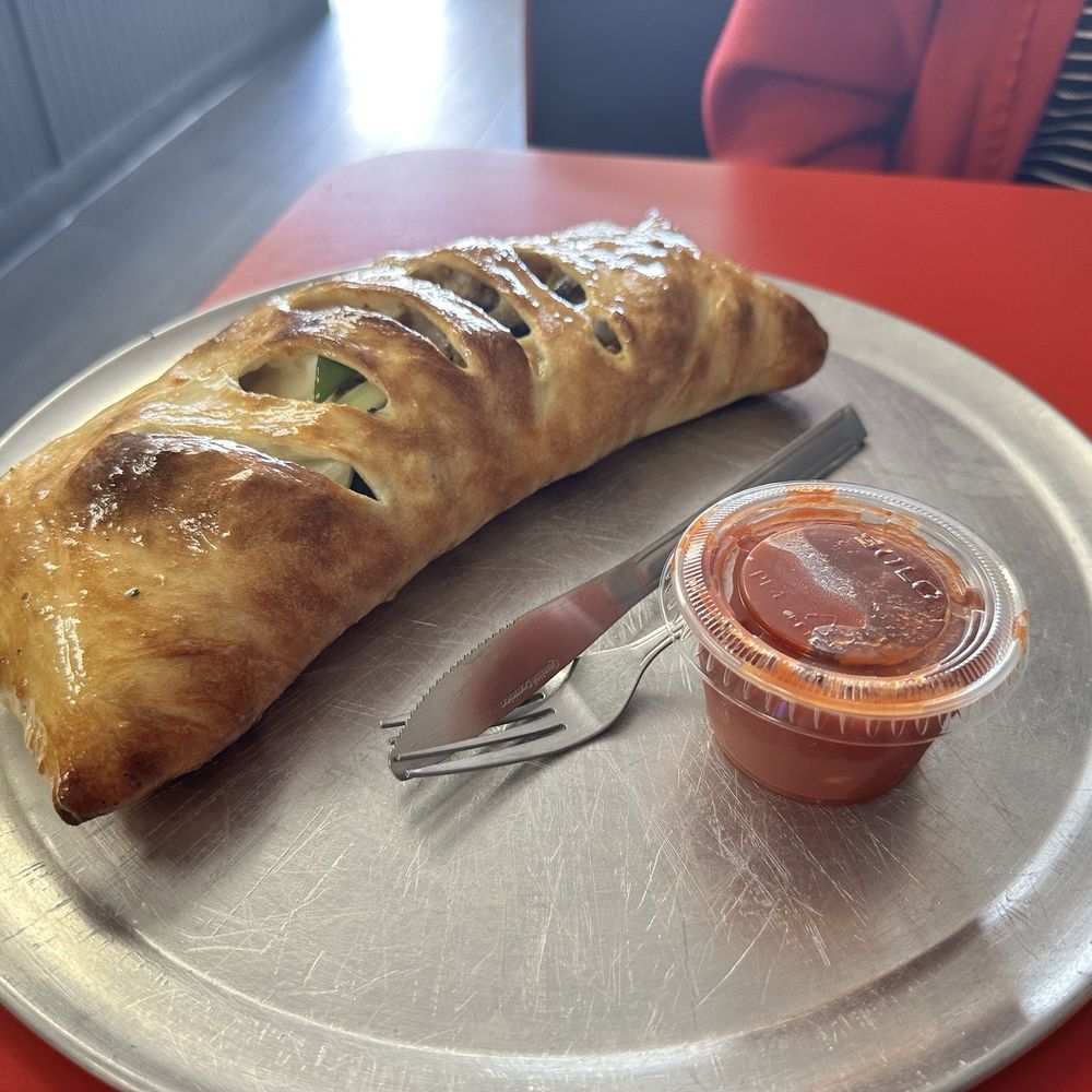 Graziano's Pizzaria - The works calzone was fantastic! Look at that golden top crust! - Pizza Near Me - Oceanside, California Graziano's Pizzaria - The works calzone was fantastic! Look at that golden top crust! - Pizza Near Me - Oceanside, California