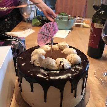 Gideon's Bakehouse - Chocolate salted caramel cake. Umbrella added for class. - Bakeries Near Me - Orlando, Florida