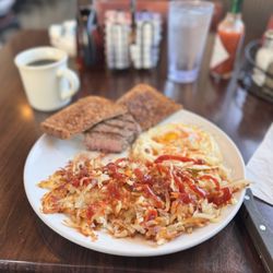 Island Cafe - 6oz Sirloin steak and eggs with wheat toast and hash browns. Very tasty