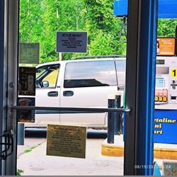 Metaline Mini Mart - Hours on Fronr Door