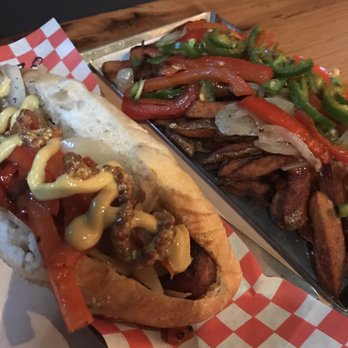 Wvrst - Chorizo with peppers & onions & dijon & grainy mustard. With a side order of dirty duck fries! - German Near Me - Toronto, Ontario Wvrst - Chorizo with peppers & onions & dijon & grainy mustard. With a side order of dirty duck fries! - German Near Me - Toronto, Ontario