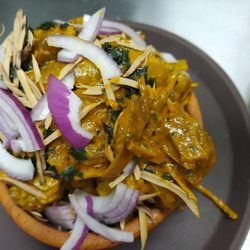 Delish Dining - Nkwobi,, cow feet mixed in palm oil sauce and spicy.. very delicious..