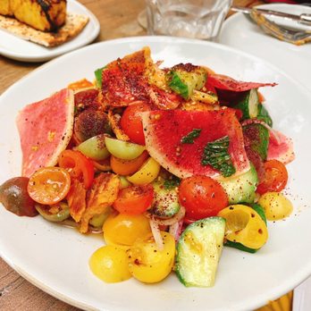 Delbar Middle Eastern - Heirloom tomato salad - Persian/Iranian Near Me - Atlanta, Georgia Delbar Middle Eastern - Heirloom tomato salad - Persian/Iranian Near Me - Atlanta, Georgia