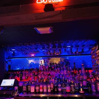 Bisbee Social Club - a bar with a neon sign - Cocktail Bars Near Me - Bisbee, Arizona