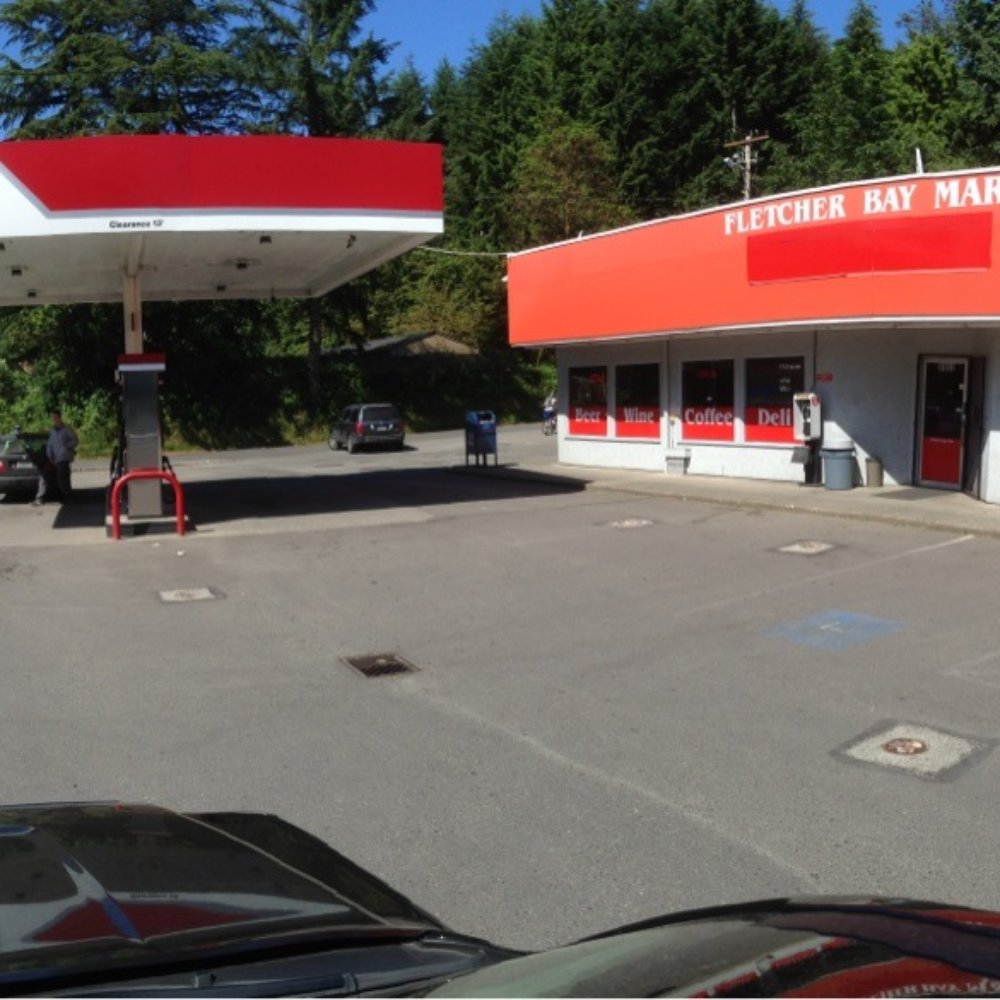 Fletcher Bay Mart - a gas station with a red and white sign - Grocery Near Me - Bainbridge Island, Washington Fletcher Bay Mart - a gas station with a red and white sign - Grocery Near Me - Bainbridge Island, Washington