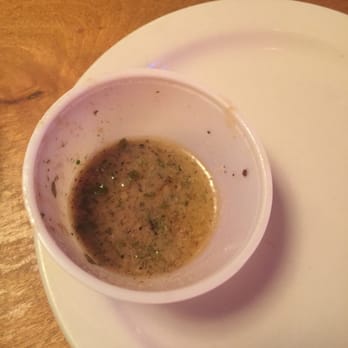 Texas Roadhouse - The lemon butter sauce I was given for my huge portion of salmon. What am I suppose to do with this? - American Near Me - Memphis, Tennessee