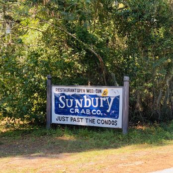 Sunbury Crab - Sign by the side of the road. You're almost there! Like it says, "Just past the condos". - Seafood Near Me - Midway, Georgia