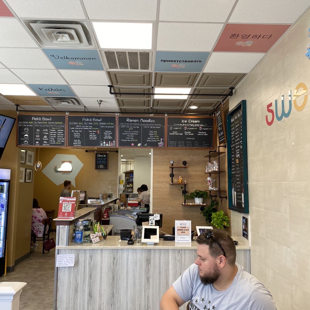 Sweet Retreat - a man sitting at a table in a cafe - Bubble Tea Near Me - Alcoa, Tennessee Sweet Retreat - a man sitting at a table in a cafe - Bubble Tea Near Me - Alcoa, Tennessee
