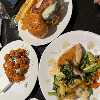 Avalanche Pub - three plates of food on a table - Pubs Near Me - Vail, Colorado