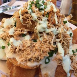 Irish nachos with shredded chicken added. The cheese sauce is yummy. Solid pub food to soak up the booze. Irish nachos with shredded chicken added. The cheese sauce is yummy. Solid pub food to soak up the booze.