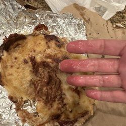 Taqueria Azteca - That's grease on my hand from the pork, cheese & bean pupusas. It's also torn apart...that's how I got it. A mess.