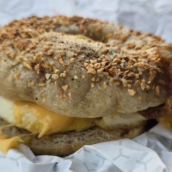 Hen’s Deli - Bacon, egg, and cheese breakfast sandwich on a garlic bagel - Sandwiches Near Me - Milwaukee, Wisconsin