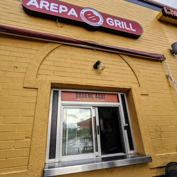 Arepa Grill - Outside ordering window. Located on the northwest corner of Plaza Fiesta. Exterior storefront. - Venezuelan Near Me - Atlanta, Georgia Arepa Grill - Outside ordering window. Located on the northwest corner of Plaza Fiesta. Exterior storefront. - Venezuelan Near Me - Atlanta, Georgia