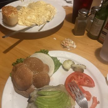 Good Harvest Cafe - The Monterey burger with a baked potato and the seafood linguine, garlic bread and a side salad.  Drinks: Coke - Seafood Near Me - Crescent City, California