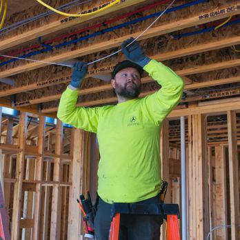 Good Energy Solutions - An electrician from Good Energy Solutions runs cable. - Solar Installation Near Me - Lawrence, Kansas