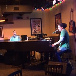 Brick House Dueling Piano Bar - Two fantastic talented vocalists and pianists playing requested hits on piano. There is also a guitar, and drums.
