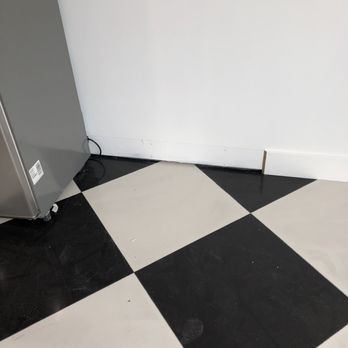 Precision Clean East Bay - Damage baseboard from getting it wet and wax residue from improperly sealing porcelain tile - Carpet Cleaning Near Me Precision Clean East Bay - Damage baseboard from getting it wet and wax residue from improperly sealing porcelain tile - Carpet Cleaning Near Me