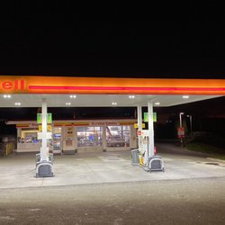 Photo of the forecourt and building during nighttime.