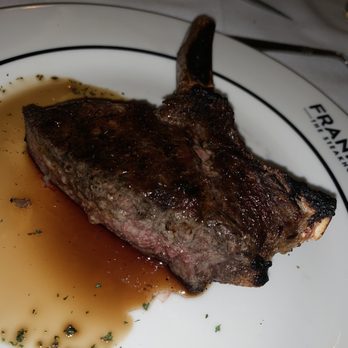 Frankie's The Steakhouse - Cowgirl ribeye cut in half - Steakhouses Near Me - Duluth, Georgia