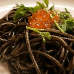 Mr. Jones Supper Club - Squid ink spaghetti with shrimp and clams, topped with ikura (salmon roe) and cilantro