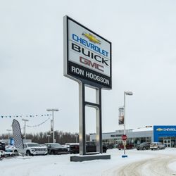 Ron Hodgson Chevrolet Buick GMC - Exterior view of the Ron Hodgson dealership sign featuring Chevrolet, Buick, and GMC