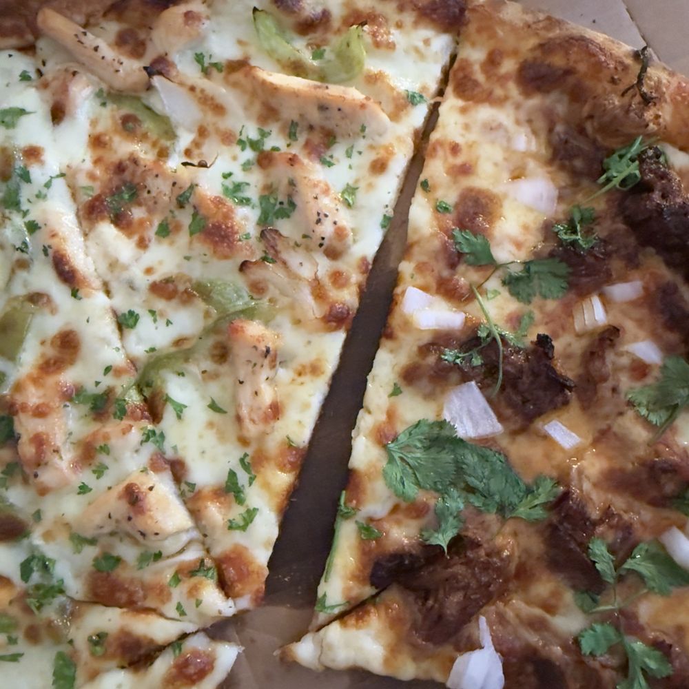 Birra pizza on right and chicken alfredo on left Birra pizza on right and chicken alfredo on left