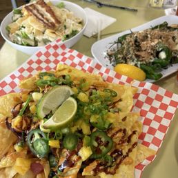 Spicy Poke Nachos, Shishito peppers, and island Caesar. Spicy Poke Nachos, Shishito peppers, and island Caesar.