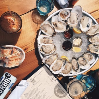 Mongers Market + Kitchen - 16 oysters (8 east coasters and 8 gulf ones), michelada with a shrimp and a plain ol beer. - Seafood Near Me - Austin, Texas Mongers Market + Kitchen - 16 oysters (8 east coasters and 8 gulf ones), michelada with a shrimp and a plain ol beer. - Seafood Near Me - Austin, Texas