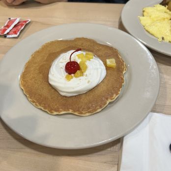 Roost - The pineapple pancakes is part of my husband's senior plate. Well with the buck the food is fresh. - Salad Near Me - New Braunfels, Texas