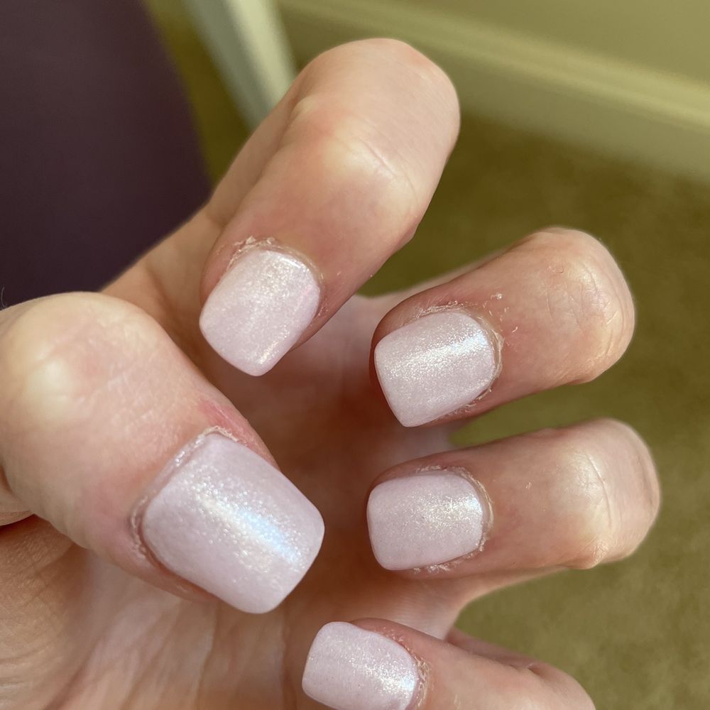 Untrimmed cuticles, badly done acrylic, and boxy shape.