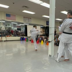 Moohan Martial Arts - Skip Side Kick Breaking during the 7th dan promotion test