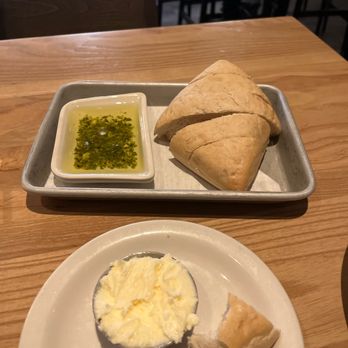 Bonefish Grill - House salad with extra vinaigrette dressing on the side. And homemade Artisan bread with pesto with olive oil, and whipped butter. - Seafood Near Me - Colorado Springs, Colorado