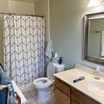 Complete Construction - a bathroom with a toilet, sink, and shower - General Contractors Near Me - Castro Valley, California