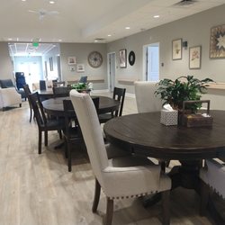 Embrace Hospice House - The common/family area with lots of tables and chairs. All patient rooms open to this area.